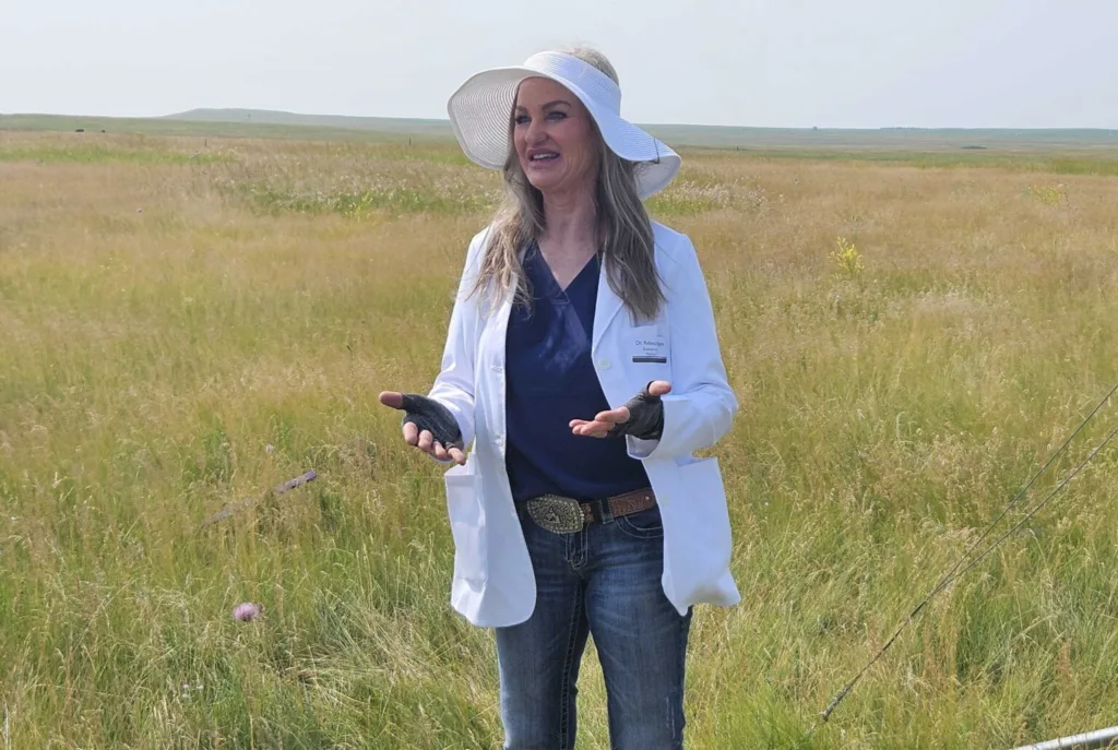 Rebecca Phillips of Ecological Insights, shown in July 2024 in Burleigh County, conducts agriculture research in North Dakota but is awaiting federal payments on some of her work. (Jeff Beach/North Dakota Monitor)