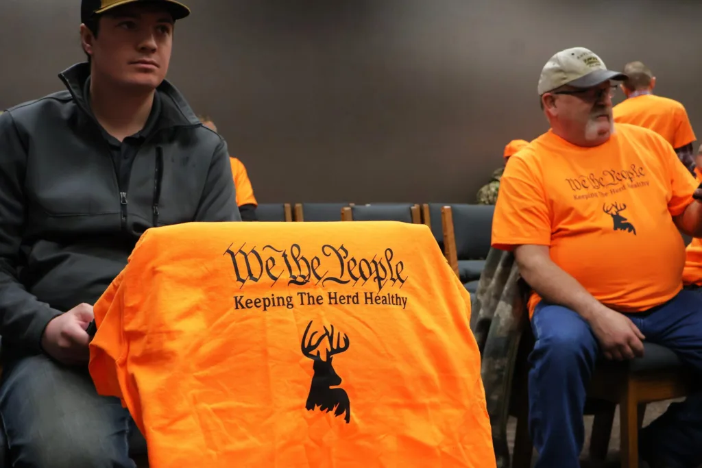 Hunters wore orange shirts to the Capitol on Jan. 17, 2025, in support of a bill to end restrictions on using bait to hunt deer. (Michael Achterling/North Dakota Monitor)
